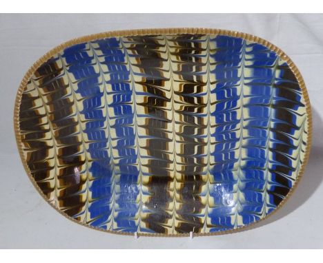 Poole pottery slipware dish , impressed swastika mark and Poole England .37.5cm x 29.5cmgood condition with just glaze crazin