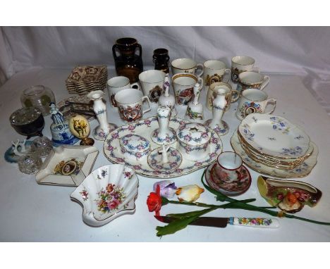 Collection of mixed ceramics to include Royal commemoratives , a china dressing table set and other items .