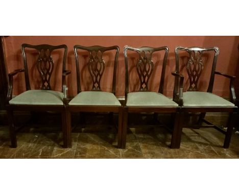 A set of twelve George III revival mahogany chairs (2x carvers + 10x chairs), in a Thomas Chippendale manner, serpentine top 