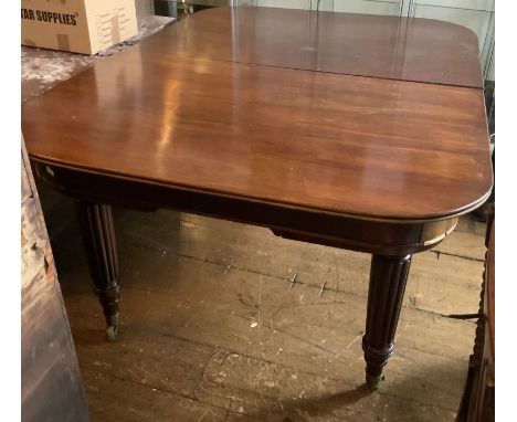 A William IV mahogany extending dining table, circa 1835, drawer leaf extending with fluted edge and curved corners, raised o