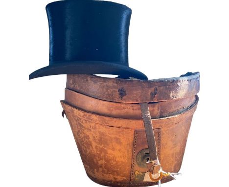 A late 19th or very early 20th century silk top hat by John Walsh, complete with leather case. The hat is in lovely, glossy c