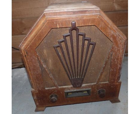 A Gecophone all electric compact receiver in angled wood case, the speaker with pierced decoration
