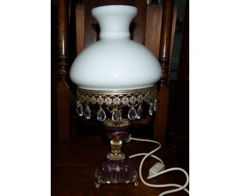 A brass electric lamp with a white glass shade and glass droplets&nbsp;