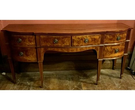 A Victorian flamed mahogany and satinwood strung breakfront sideboard, slight oversailing top, over two shaped frieze drawers