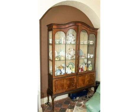 An early 20th century walnut veneered glazed display cabinet, approx 121cm wide (as found legs will need re-glueing); togethe