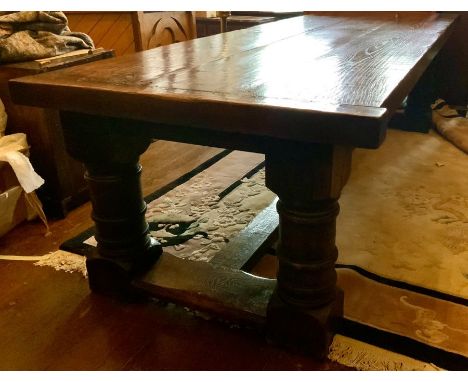 A large oak and elm refectory dining table, incorporating in a 16/17th century manner, three plank top with cleated ends, cus