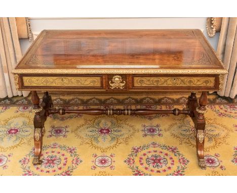 A George IV rosewood and mahogany brass inlaid library table, attributed to Morel & Seddon circa 1825, the rosewood top with 