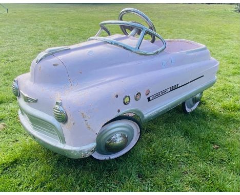 A 1950's Style Metal Super Sports Pedal Car in Pink (100cm approx)