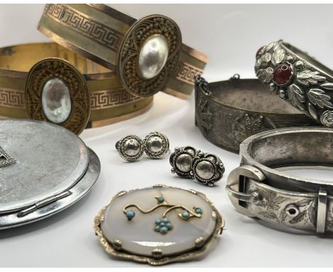 A selection of late 19th - early 20th century jewellery to include an 1890s hallmarked silver buckle bangle with an unusual p