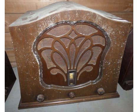 A G, Marconi early 20th century radio in shaped wood case, the speaker with fretted decoration