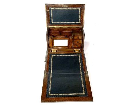 A late Victorian oak stationary box, circa 1900, moulded edge lid that reveals a fall front folding leather inlay writing slo