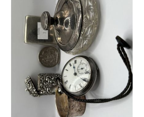 An Edwardian, English made, silver pocket watch with open face, WE sponsors mark, Birmingham 1907; a silver match book with p