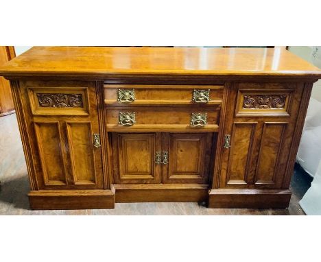 A Victorian oak and pollard oak inverted sideboard by Thomas Turner, Manchester model no 16843, circa 1900, moulded edge top 