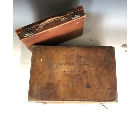 Two vintage suitcases, the larger inscribed with Captain W. Shannon 16th Lancers Government House New Zealand