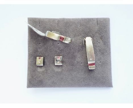A contemporary brushed white-metal Modernist design demi-parure, comprising ring, pendant, and stud earrings, each incorporat