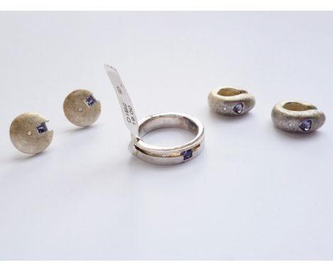 A contemporary brushed white-metal ring and stud earring set, each in a Modernist design incorporating sunken gemstones, toge