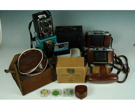 Sundry cameras, including a Polaroid Swinger II land camera, an Agfa Solette camera, a boxed Coronet camera, an Agfa Super So