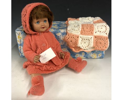 A 1940s doll with crying voicebox and weighted / sleeping eyes, dressed in a vintage hand-knitted costume 