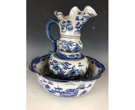 A Regency Ironstone Willow pattern jug and wash basin set