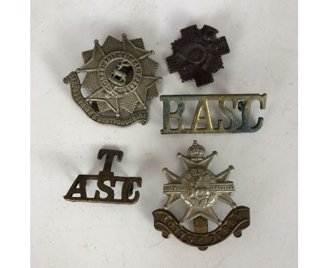 A small quantity of British army cap and other badges including a T-ASC shoulder title