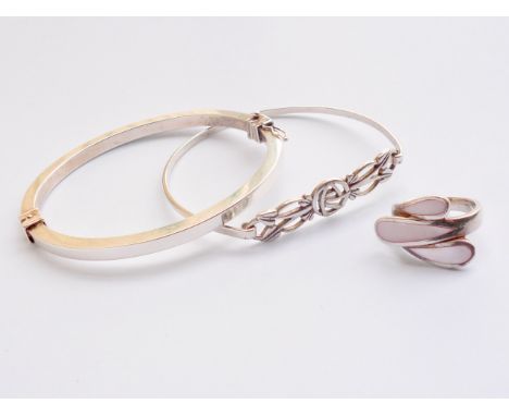 An Elizabeth II silver hinged-bangle, of square section, one further Charles Rennie Mackintosh inspired white-metal bangle, a