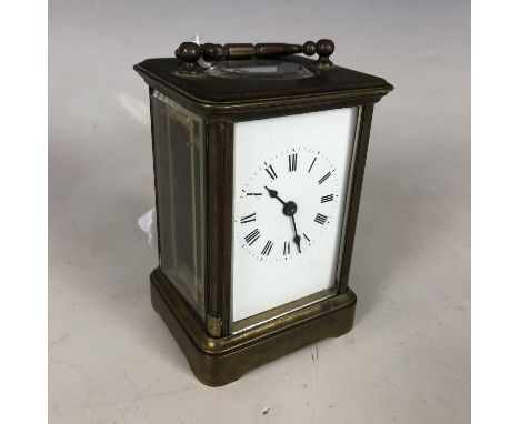 A diminutive brass Corniche-cased carriage clock, late 19th / early 20th Century, 10 cm high (excluding handle)