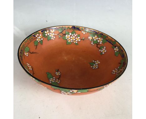 An early 20th Century Royal Doulton aesthetic / secessionist orange lustre bowl decorated in a raised enamel blossom pattern,