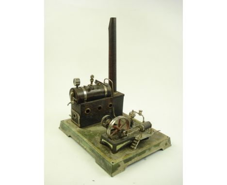 An early 20th century Continental tinplate model of a stationary engine:, possibly Bing, the boiler with manometer water outl