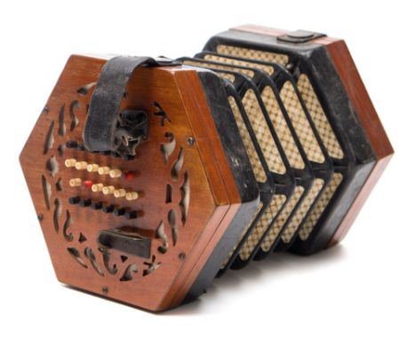 A late 19th/early 20th  century squeezebox:, numbered 41951, with black and red stained ivory keys on pierced fretwork ends w