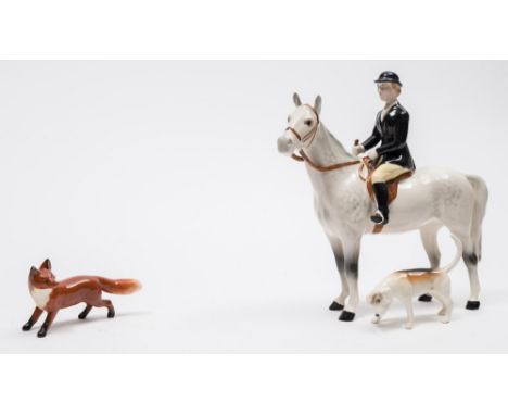 A Beswick Hunting group:, comprising Huntswoman style two, standing model 1730, Girl on a Pony model 1499, one fox and eight 