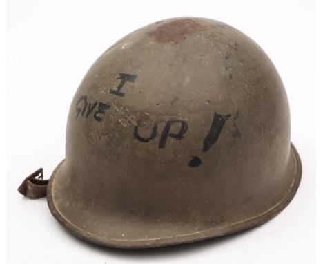 A  US army M1 pattern helmet: with fibreglass liner and canvas straps.