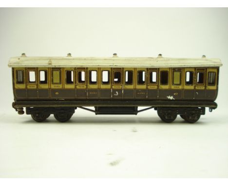 An L & NWR First & Third class passenger coach No 1153 by Marklin, Germany:,  with retailer's mark to underside for A W Gamag