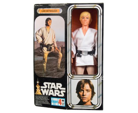 A 1977 issue Star Wars 'Luke Skywalker' 12 inch action figure by Clipper Toys, Amsterdam:, in white tunic with utility belt, 