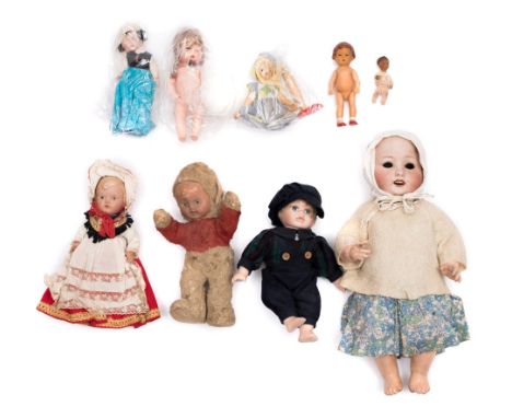 An Armand Marseille bisque head doll: repaired, and a collection of various dolls including a Chiltern plush Imp.