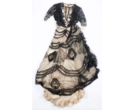 An early 20th century lady's black and white silk and lacework blouse and skirt:, the front panel of the blouse with floral e