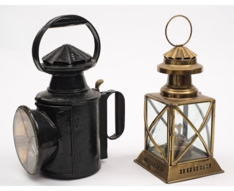 A railway man's hand signal lamp together with a later square brass lamp:, the former with double shades and associated burne