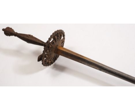 An 18th century small-sword:, the tri-form blade with scroll engraved decoration over a cut steel shell with bright cut decor