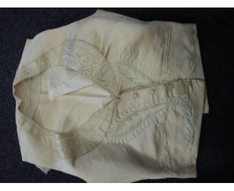 A 19th century ivory silk gentleman's waistcoat: and beadwork bag.