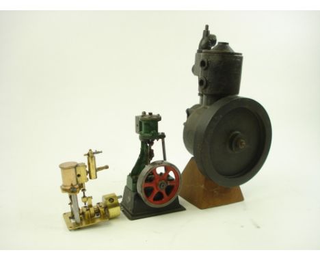 A Stuart type model of a vertical engine with 3 inch flywheel:, together with an iron pump with 6 inch flywheel on later wood