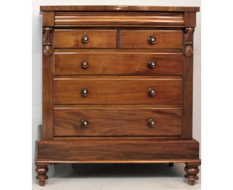 A VICTORIAN MAHOGANY CHEST OF DRAWERS ON STAND, the rectangular top above a cushion drawer with two short drawers below, flan