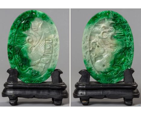 A CHINESE JADE PLAQUE, of oval form, carved on one side with a bylin and phoenix to the reverse, the body of the plaque of ap