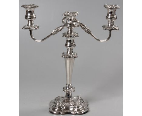 A SILVER CANDELABRUM, SHEFFIELD 1966, EHP CO. LTD., the removable three light brack with embossed wax pans, the centre tapere