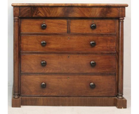 A VICTORIAN MAHOGANY CHEST OF DRAWERS, the moulded top above a flamed veneered cushion drawer with two short and three wide d