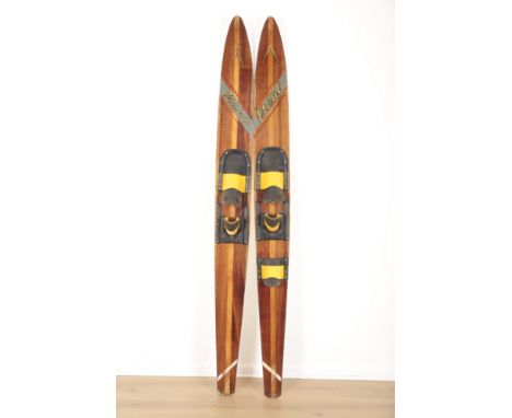 A PAIR OF WOODEN VINTAGE WATER SKIS BY MONO&nbsp;late 20th century, the striped two tone wood with rubber footholds, 75cm lon