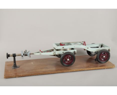 A 'HOMH MODELLE' CUTAWAY TRAILER1950's, the rubber tyres stamped '6.00-1'6' the model mounted on wooden plank, 21cm high x100