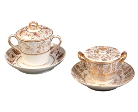 TWO ENGLISH PORCELAIN CHOCOLATE CUPS, COVERS AND STANDSearly 19th century, one with a white ground decorated with gilt border