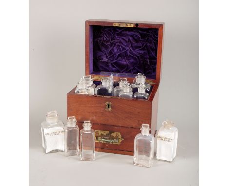 A MAHOGANY DOMESTIC MEDICINE CHEST OR APOTHECARY CHEST19th century, with a hinged lid, opening to reveal twelve glass bottles