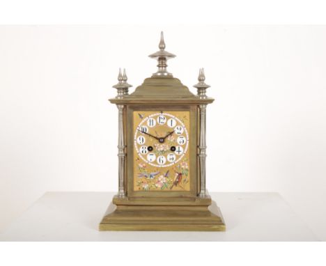 AN ORMOLU MANTEL CLOCK IN THE AESTHETIC STYLElate 19th century, the top with pagoda like finials, the dial and sides with clo