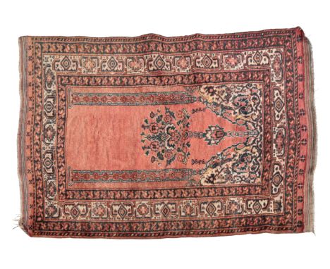 AN ANTIQUE BELUCH PRAYER RUGwoven in blue and off-white with a hanging basket of flowers within arch on an open madder ground