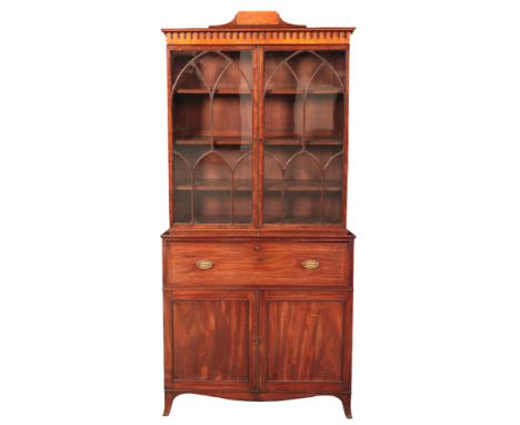 A LATE GEORGE III MAHOGANY SECRETAIRE BOOKCASEthe upper section with a moulded and satinwood banded pediment over glazed door